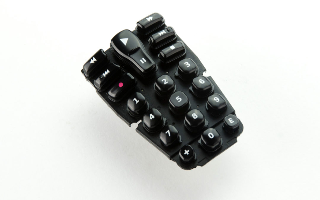 Silicone rubber keypad with domed protection layer applied to each key
